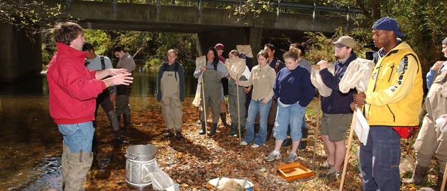 Zoology major students at the creek